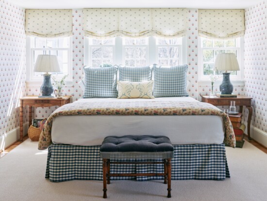 Décors Barbares’ floral print linen voile, “Polonaise”, drapes the windows in the bedroom, where the bed is flanked by tables from Heritage in Charlotte. 