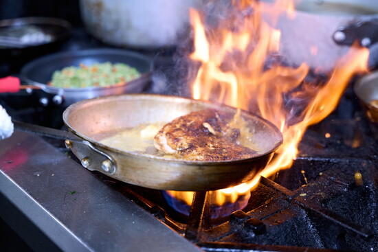 Chef Mario Valasquez at the stove in Cotton Hollow Kitchen
