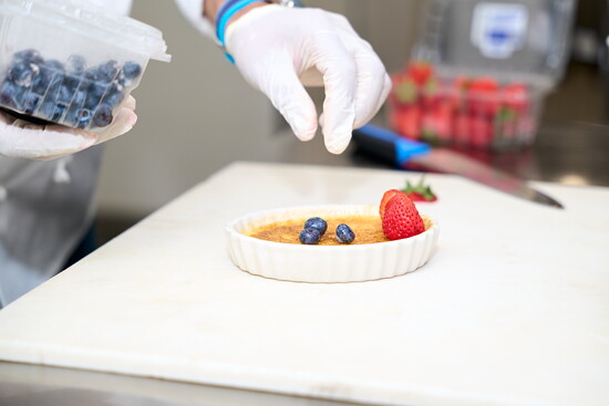 Chef Mario Valasquez creating a dessert in Cotton Hollow Kitchen