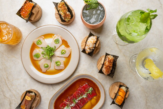 An assortment of dishes and vibrant cocktails