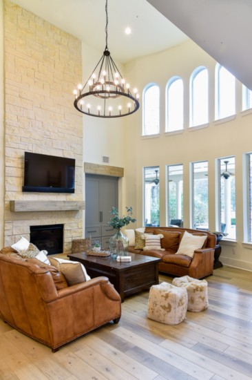 A spacious family room with a faux-wood vinyl floor is both aesthetically pleasing and functional.