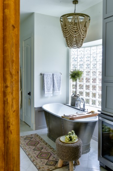 A modern farmhouse style tub is a place for relaxation and refreshment.