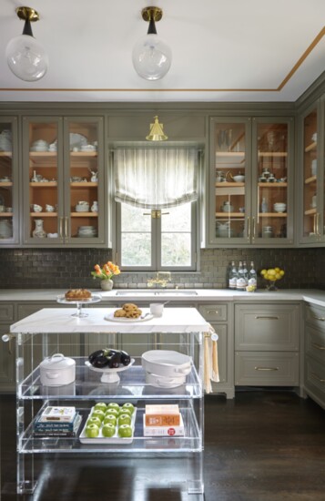 Courtney Hill Fertitta designed this wide kitchen with side-by-side islands which are great for entertaining. Photo by Tria Giovan