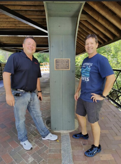 Ryan Messner and Aaron Underwood with the plaque commemorating the bridge's inclusion on the National Register of Historic Places.