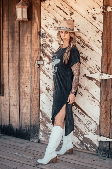 Long graphic t shirt dress - taupe hat with silver/turquoise band, white western boots.