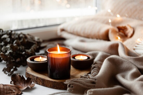 1. Cozy up with warm lighting provided by candles and string lights.