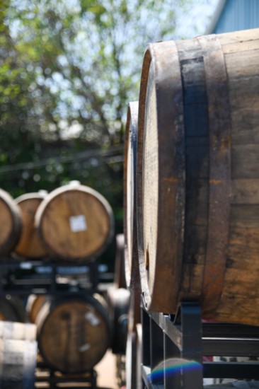 Some of (405) Brewing Co.s wooden barrels, where their "liquid art" begins to take place