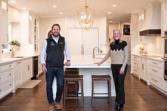 Brent Crank, owner of Brent Thomas Renovations and Kelly Fanta of House of Design in the Mattingley's finished kitchen. 