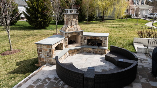 Outdoor fireplaces and custom pits extend the usability of backyards, creating a warm atmosphere for evening gatherings.