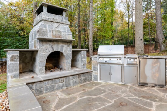 The outdoor kitchen and fireplace are great for family gatherings.