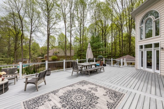 The upstairs deck is accessible from the home and patio.