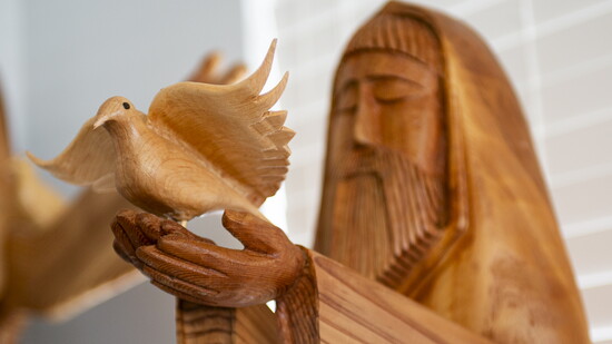 With decades of carpentry experience, John expertly crafts and connects artistic touches like this dove.