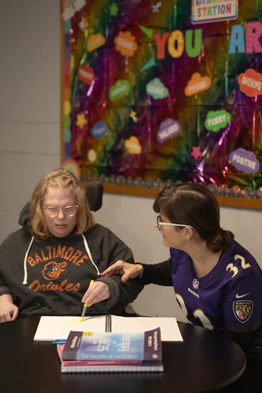 Joy Barton at Harford Center working with a participant. Photo Credit: Kerry Paradis Photography