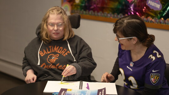 Joy Barton at Harford Center working with a participant. Photo Credit: Kerry Paradis Photography