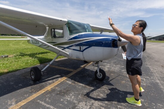 Student, Vantha Embry pre-flights her plane