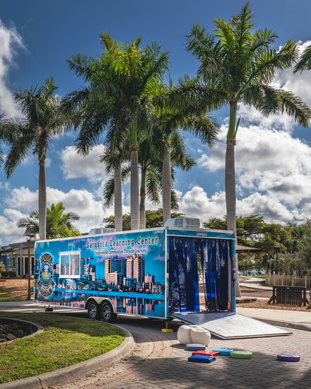 The rear doors of the Sarasota Learning Center open to reveal a vibrant mobile classroom built for education, technology and community outreach.