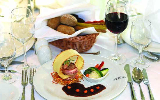 Savor gourmet cuisine, fine wines, and elegant dining experiences while cruising