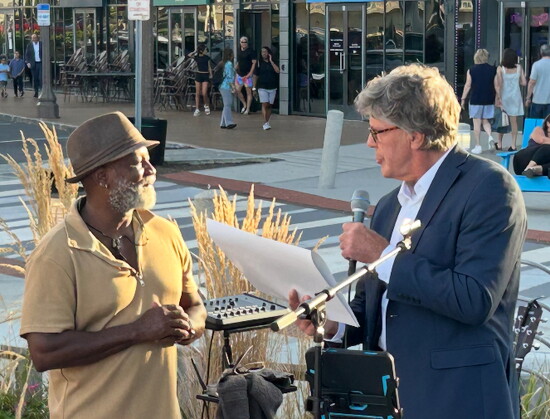 Long Branch Mayor John Pallone presenting a heartfelt proclamation to Jeffier Lamar 