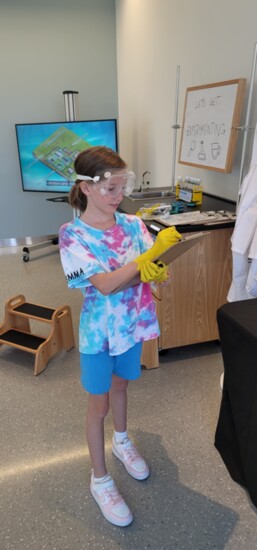 Emma Performing an Experiment in Hydro