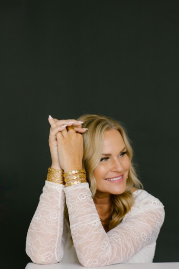Pam Duke, Owner/Designer of Nau-T-Girl Jewelry is wearing her choice of gold-plated cuffs. 