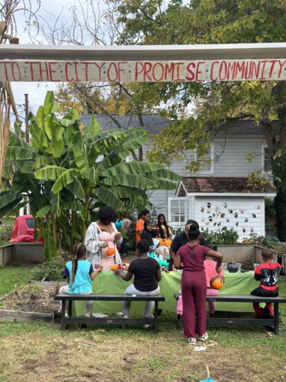 Youth painting pumpkins in the City of Promise Garden. Photo credit: Aleen Carey