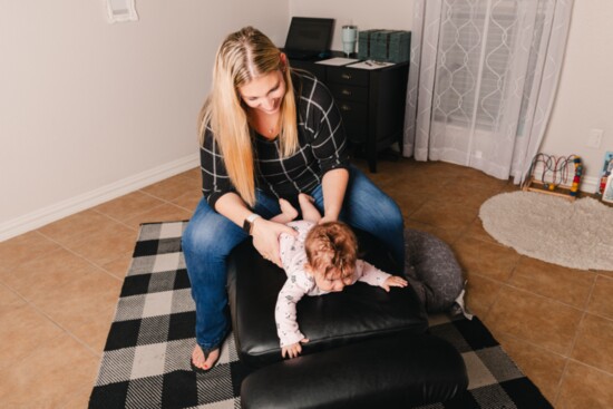 A chiropractic session can help babies who are learning to crawl and walk