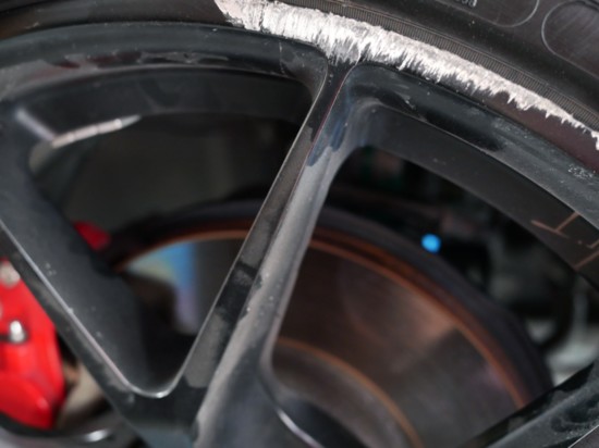 Damage cause to the tire rim from sliding into a curb can be repaired. 