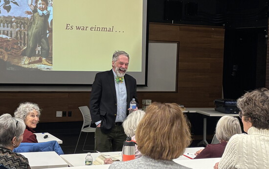 Storyteller Tom Lee shares a chuckle with his Grimm’s Fairy Tales class.