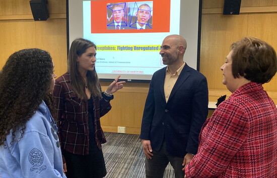 The topic of AI in Media prompts discussions with Professor Adam Chiarra.