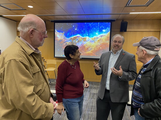 Discussions spill over after class on the latest in space exploration in Aeronautic Engineering Professor Paul Slaboch’ course.