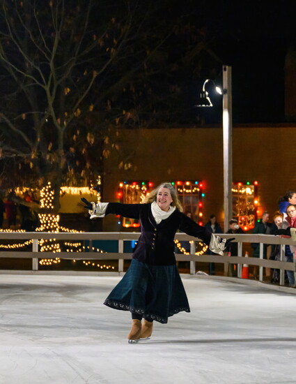 Siobhan Tully from North Hampton skates with the “Currier & Ives Vintage Skaters” at the annual Candlelight Stroll in Strawbery Banke