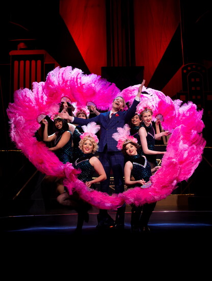 David Hardy surrounded by the girls of cell block six in Mason High School's production of "Chicago, Teen Edition" in 2019.