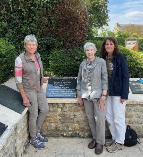 Carol Kersting, Mary Anne (Annie) Zaya + Linda Penn, daughters of Daniel McIlvoy, at a plaque at La Fiere Bridge in Normandy honoring their father.