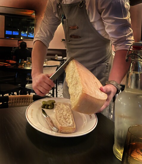 Melted Swiss raclette, also popular in alpine areas of France, Germany and Austria, is a treat at Mon Chou Chou in the Pearl District. (Photo by Elaine Warner)