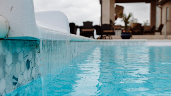 This pool is the centerpiece of an outside oasis.