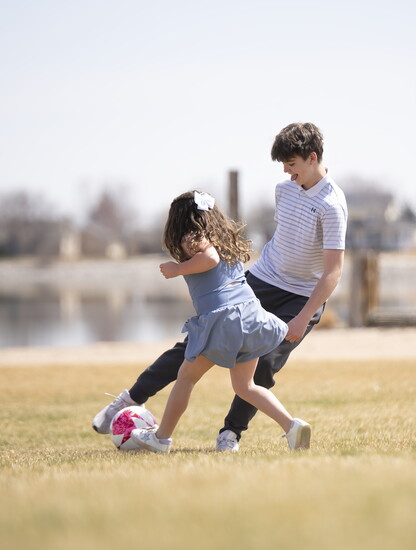 Brooklyn McGee and Collin Kinyon burn off some energy at Boardwalk Park.