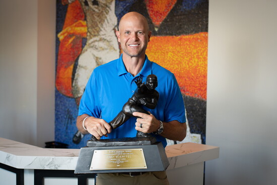 Danny Wuerffel proudly holds his Heisman Trophy.
