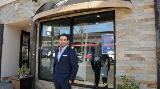 Manoj Daswani outside Daswani Clothiers, a family-owned men's clothing store and tailors. 