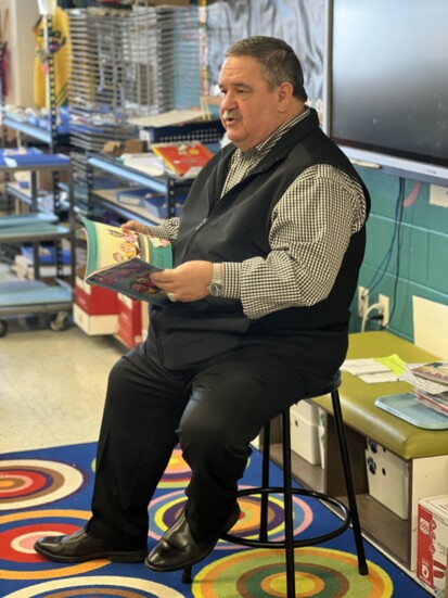 Mayor John Gates reads to an elementary class for Read Across America.