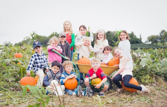 A happy group of pumpkin pickers at Butler's Orchard