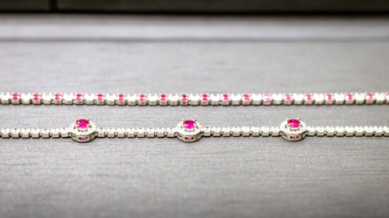 Sterling silver tennis bracelets with cubic zirconia.