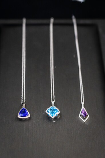 Necklaces L-R Trillion Tanzinite, Blue Topaz, and Purple Amethyst.