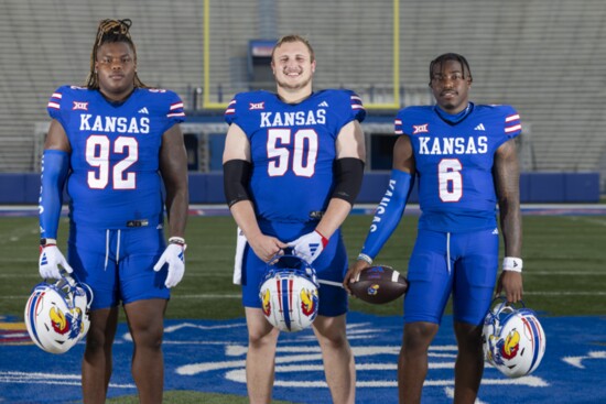 KU DL Tommy Dunn, Jr., C Mike Novitsky and QB Jalon Daniels in the new all-blue uniforms for 2023
