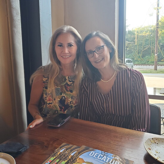 Christina Carter, of Chad & Christina Carter Real Estate, and Carol Hill, with Wellroot Family Services
