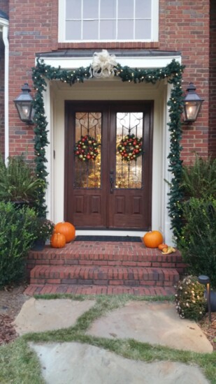 Use a swag of garland to frame the front door.