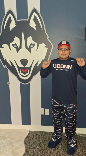 Elijah in his UConn themed bedroom. 