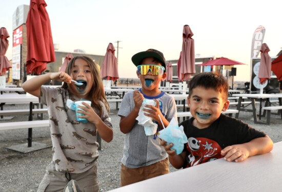 Children cool down with snocones.