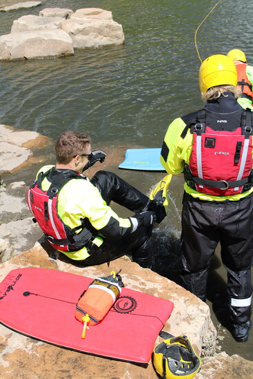 Firefighters Pearcey and Murphy suit up for an aggressive swim maneuver training.