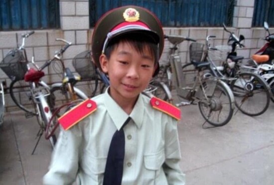 Derek in his band uniform from the orphanage when he was 10