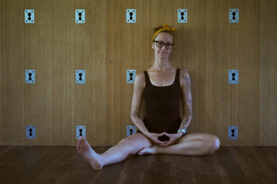 Nicole Haring in front of the yoga wall